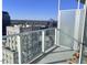 Private balcony with city views and a frosted glass partition at 110 N Corcoran St # 2104, Durham, NC 27701