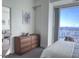 Spacious bedroom with city views and large dresser at 110 N Corcoran St # 2104, Durham, NC 27701