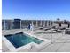 Rooftop hot tub with city views and lounge chairs at 110 N Corcoran St # 2104, Durham, NC 27701
