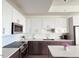 Modern kitchen with stainless steel appliances and island at 110 N Corcoran St # 2104, Durham, NC 27701