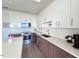 Modern kitchen with stainless steel appliances and island at 110 N Corcoran St # 2104, Durham, NC 27701