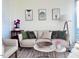Modern living room with a light beige couch and stylish decor at 110 N Corcoran St # 2104, Durham, NC 27701