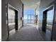 Building lobby with elevators and a view of the outdoor pool at 110 N Corcoran St # 2104, Durham, NC 27701