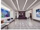 Modern building lobby with reception desk and art at 110 N Corcoran St # 2104, Durham, NC 27701