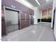 Modern building lobby with elevators and mailboxes at 110 N Corcoran St # 2104, Durham, NC 27701