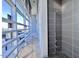 Modern outdoor shower with gray tile and a sleek, stainless steel shower head at 110 N Corcoran St # 2104, Durham, NC 27701