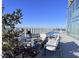 Relaxing rooftop pool with lounge chairs and fire pit at 110 N Corcoran St # 2104, Durham, NC 27701