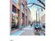 Building exterior showcasing a sidewalk cafe and urban streetscape at 110 N Corcoran St # 2104, Durham, NC 27701