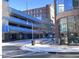 City street view with parking garage and shops at 110 N Corcoran St # 2104, Durham, NC 27701
