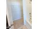 Bright bathroom featuring a tub, a shower and a storage rack at 111 Central Townes Way # 299, Raleigh, NC 27603