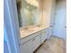 Modern bathroom with a double vanity, granite countertops, and tile flooring at 111 Central Townes Way # 299, Raleigh, NC 27603