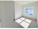 Bright bedroom with a large window providing natural light and neutral colored walls at 111 Central Townes Way # 299, Raleigh, NC 27603