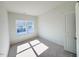 Bright bedroom featuring neutral colored walls and a large window that provides natural light at 111 Central Townes Way # 299, Raleigh, NC 27603