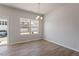 The dining area features an adjacent sliding glass door to the outside and natural light at 111 Central Townes Way # 299, Raleigh, NC 27603