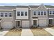 Charming townhome with a one-car garage, a well-manicured lawn, and a stylish facade at 111 Central Townes Way # 299, Raleigh, NC 27603