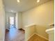 Bright foyer with hardwood floors, staircase and access to the front door at 111 Central Townes Way # 299, Raleigh, NC 27603