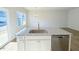 Kitchen island with granite countertop and stainless steel dishwasher at 111 Central Townes Way # 299, Raleigh, NC 27603