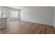Open-concept living space featuring hardwood floors and neutral paint at 111 Central Townes Way # 299, Raleigh, NC 27603