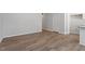 Open living space featuring neutral paint, base trim, and hard wood floors at 111 Central Townes Way # 299, Raleigh, NC 27603