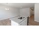 Spacious open floorplan featuring modern hardwood floors, and bright neutral paint at 111 Central Townes Way # 299, Raleigh, NC 27603