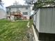 Spacious backyard showing large yard and a deck with stairs, plus a storage shed on the side at 112 Gingergate Dr, Cary, NC 27519