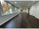 Expansive finished basement with dark floors, bright white walls, with bar at 112 Gingergate Dr, Cary, NC 27519