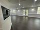 Finished basement featuring modern lighting, and a walkout to the backyard at 112 Gingergate Dr, Cary, NC 27519