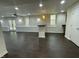 Finished basement space boasts a modern bar area and walk-out access to outdoor living at 112 Gingergate Dr, Cary, NC 27519