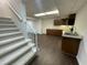 Stairway leading to a basement with kitchenette at 112 Gingergate Dr, Cary, NC 27519
