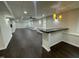 Basement with bar, recessed lighting and stained concrete floors at 112 Gingergate Dr, Cary, NC 27519