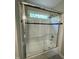 Clean bathroom featuring a glass shower enclosure, tile accents, and white tile at 112 Gingergate Dr, Cary, NC 27519