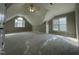Spacious bonus room with lots of natural light and new gray carpet at 112 Gingergate Dr, Cary, NC 27519