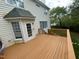 View of the wooden deck and stairs, showcasing its size and access to the backyard at 112 Gingergate Dr, Cary, NC 27519