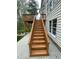 Exterior of a home showing the deck stairs and access to the backyard at 112 Gingergate Dr, Cary, NC 27519