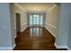 Dining room with hardwood flooring, elegant chandelier, and bay window allowing natural light at 112 Gingergate Dr, Cary, NC 27519