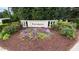 Community entrance sign amid landscaping and mulch at 112 Gingergate Dr, Cary, NC 27519
