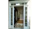 Elegant entryway featuring a hardwood staircase and a decorative glass front door at 112 Gingergate Dr, Cary, NC 27519
