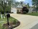 Spacious home with a long driveway, two-car garage, and well-manicured landscaping at 112 Gingergate Dr, Cary, NC 27519