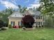 Beautiful two-story brick home with manicured lawn and landscaping at 112 Gingergate Dr, Cary, NC 27519