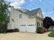 Two-car garage with traditional design, enhancing the home's curb appeal at 112 Gingergate Dr, Cary, NC 27519