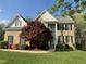 Charming brick two-story home with manicured lawn and mature landscaping at 112 Gingergate Dr, Cary, NC 27519