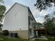 Siding exterior with bay windows and deck with stairs and wooded backyard at 112 Gingergate Dr, Cary, NC 27519