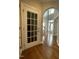 Foyer and entry with dark hardwood floors and doors to other rooms at 112 Gingergate Dr, Cary, NC 27519