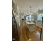 Modern kitchen features an island, stainless steel appliances, and hardwood floors leading to the living room at 112 Gingergate Dr, Cary, NC 27519
