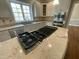 Well-equipped kitchen with modern appliances, granite countertops, and ample cabinet space at 112 Gingergate Dr, Cary, NC 27519