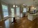 Spacious kitchen with an island, granite countertops, stainless steel appliances, and a breakfast area at 112 Gingergate Dr, Cary, NC 27519