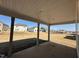 Covered patio with view of a spacious backyard in a neighborhood setting at 1125 Channel Drop Lp, Zebulon, NC 27597