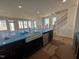 New kitchen features a large island with sink and stainless dishwasher. Bright with natural light at 1125 Channel Drop Lp, Zebulon, NC 27597