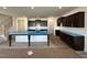 New kitchen features a large island, dark cabinets, stainless appliances, and an adjacent pantry at 1125 Channel Drop Lp, Zebulon, NC 27597