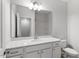 Bathroom featuring a single vanity, large mirror, and modern finishes at 115 Central Townes Way # 300, Raleigh, NC 27603